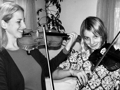 Christine Orio giving a violin lesson to student in West Sand Lake, NY
